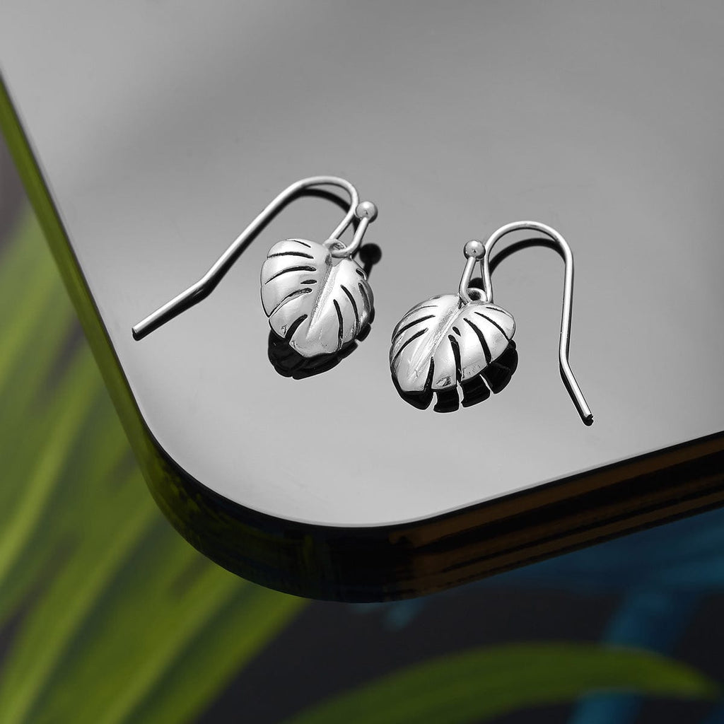 silver plated leaf drop earrings cheese plant in 18k silver plated vintage inspired jewellery by Lovett and co. Pictured on a black background