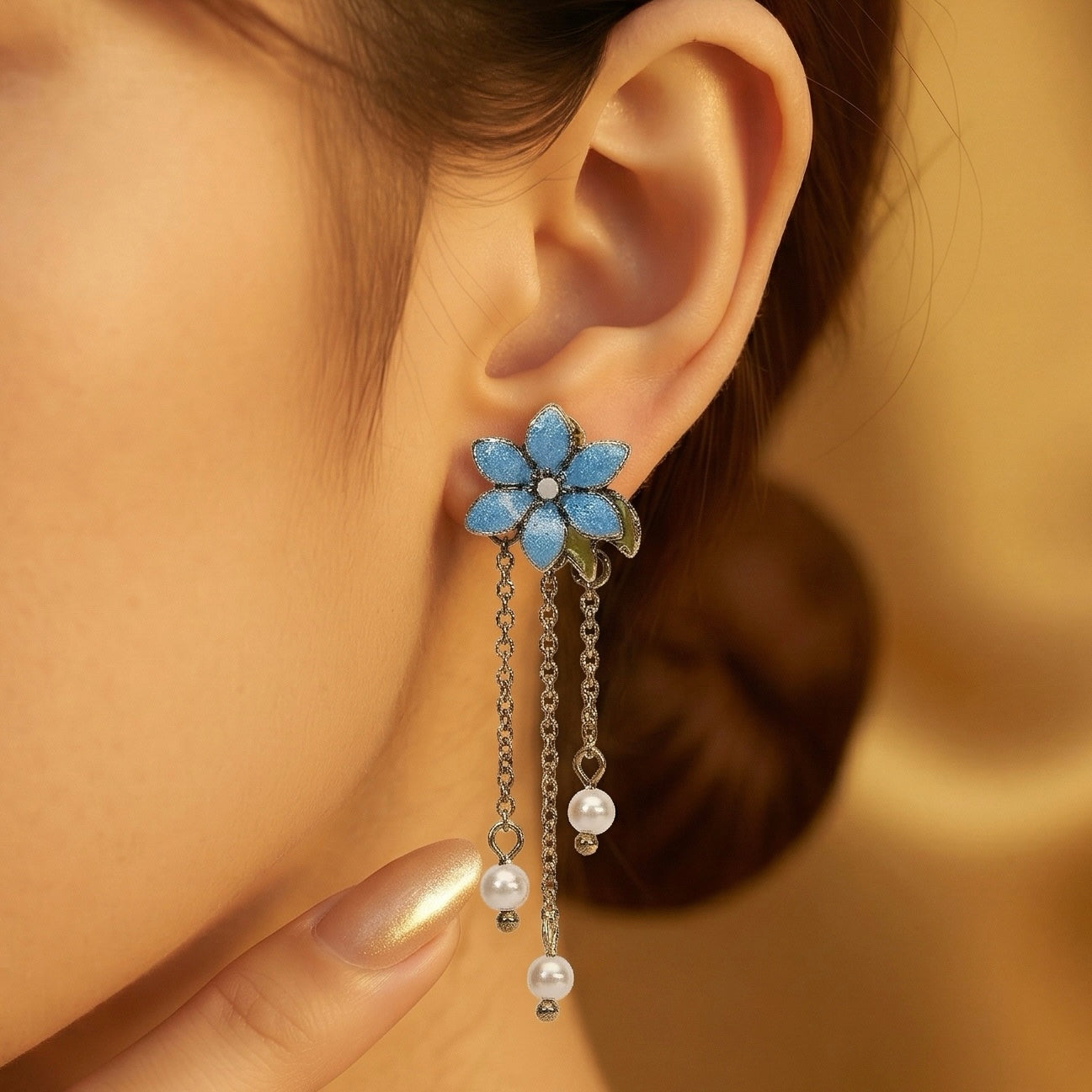 Long pearlised blue flower drop earrings  Lovett & Co