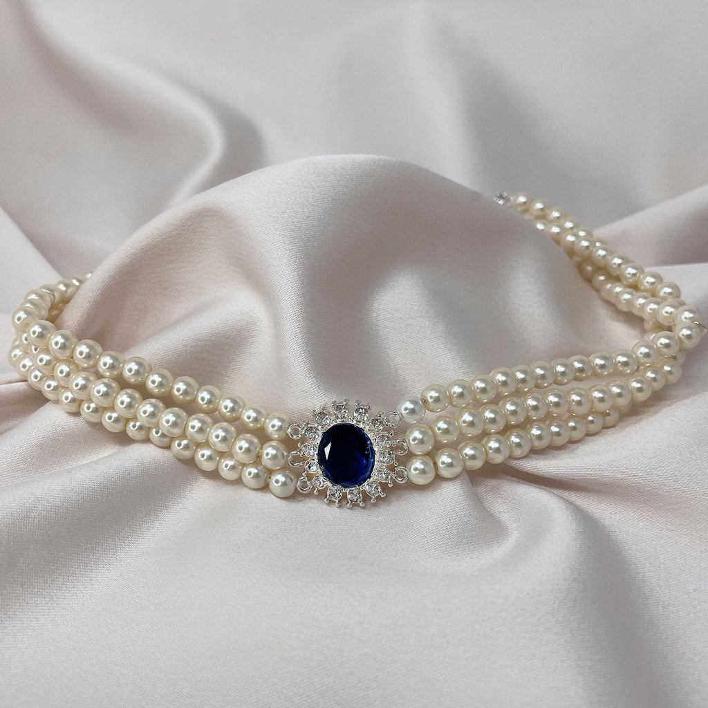Lady Diana inspired 3 row pearl choker with Sapphire stone in the centre. 